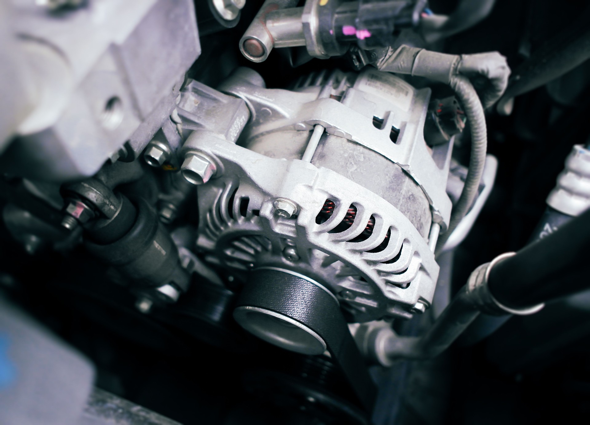 Car alternator or generator in a car engine compartment