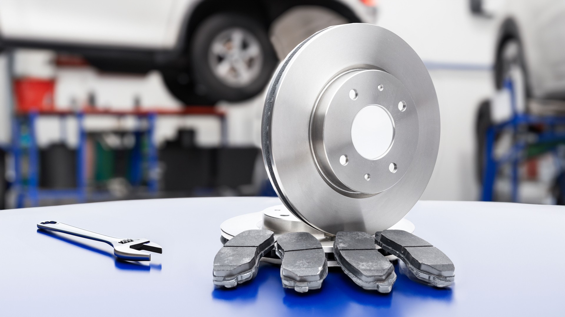 New brake discs and pads at the car repair shop