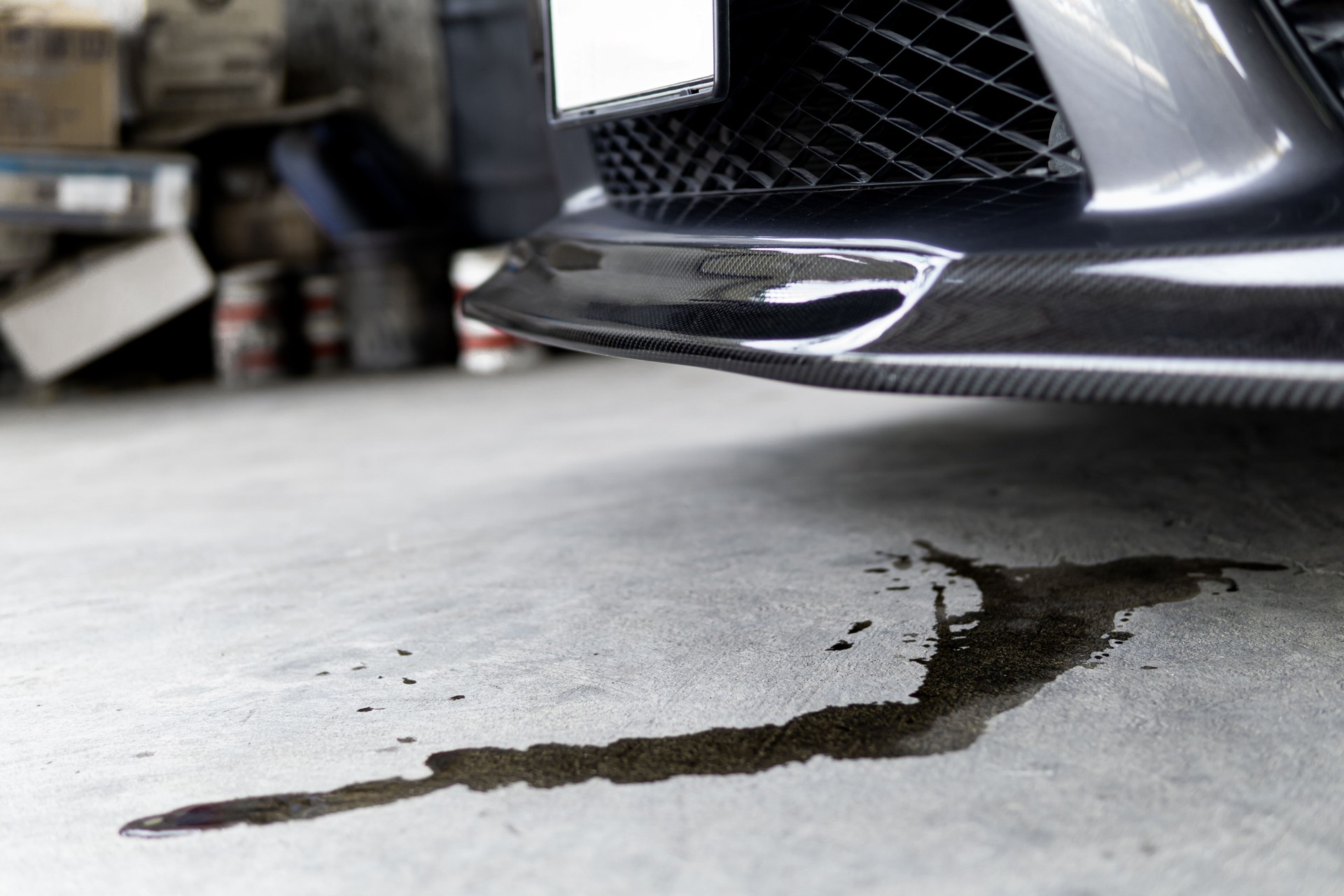 Engine oil stains of car Leak under the car when the car is park on the road  service photo concept for check and maintenance